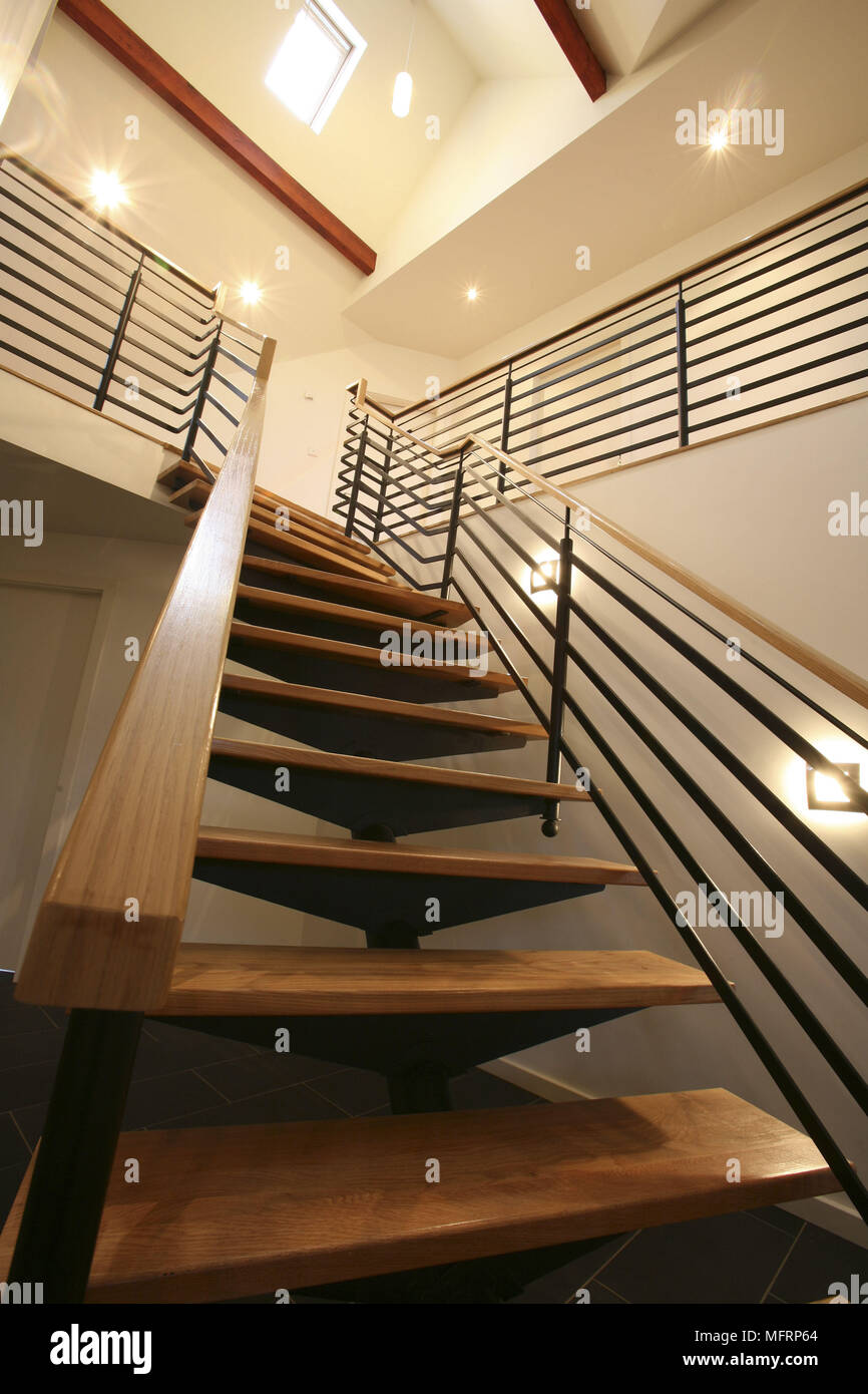 View from below of contemporary staircase with wooden steps Stock Photo