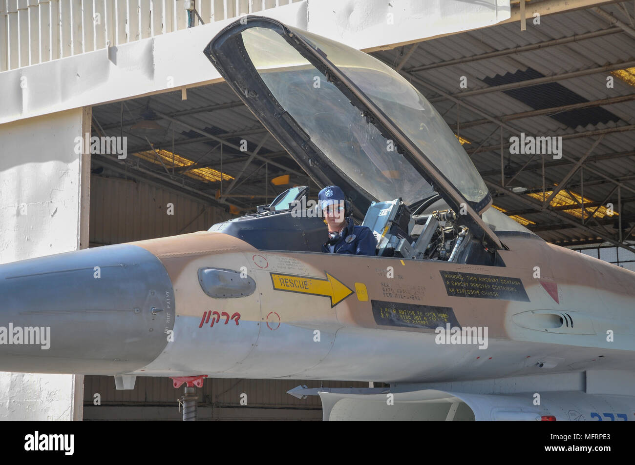 Technician in the cockpit of an IAF f-16 Stock Photo