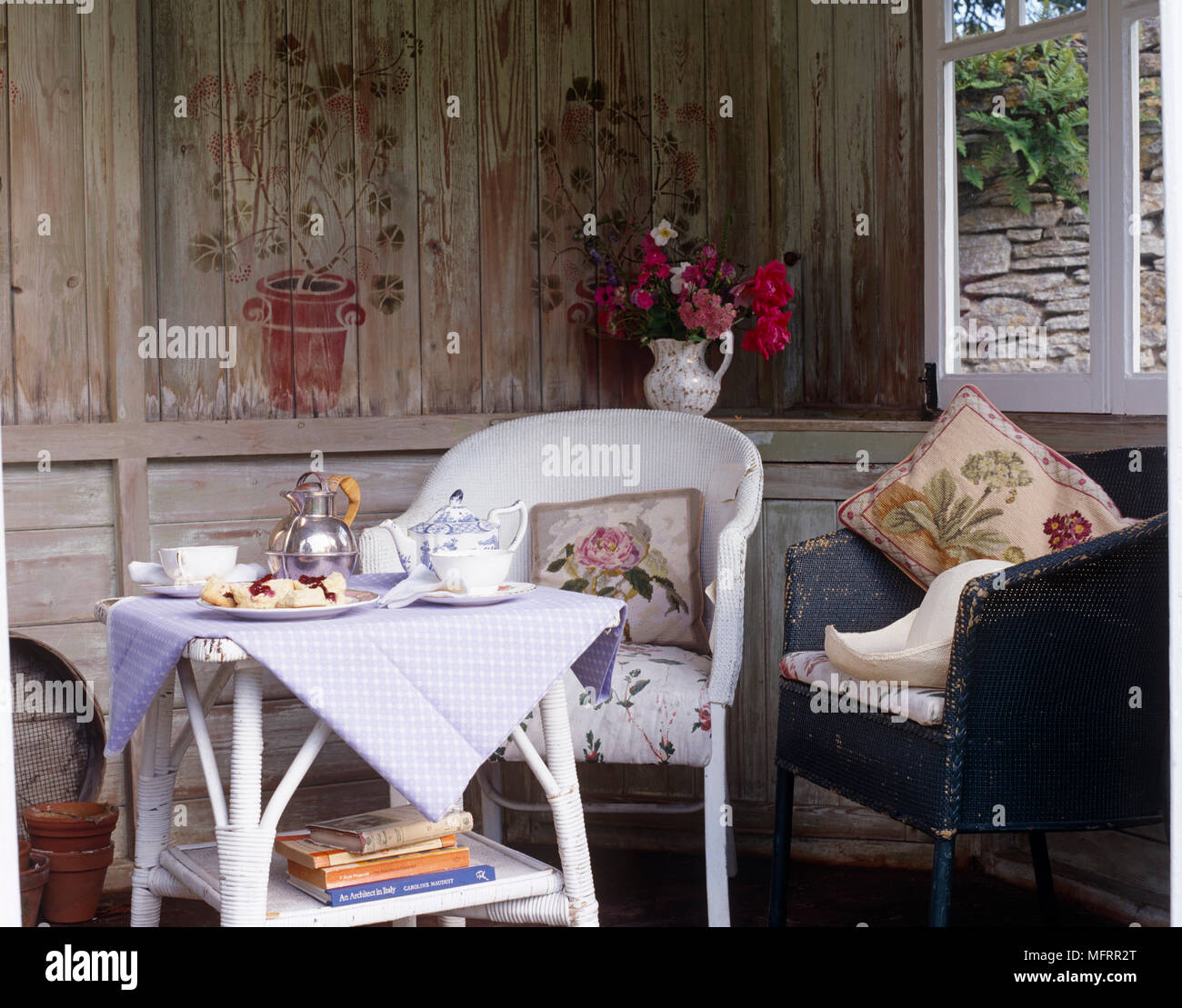 Garden table and chairs in summer house with afternoon tea Stock Photo Alamy