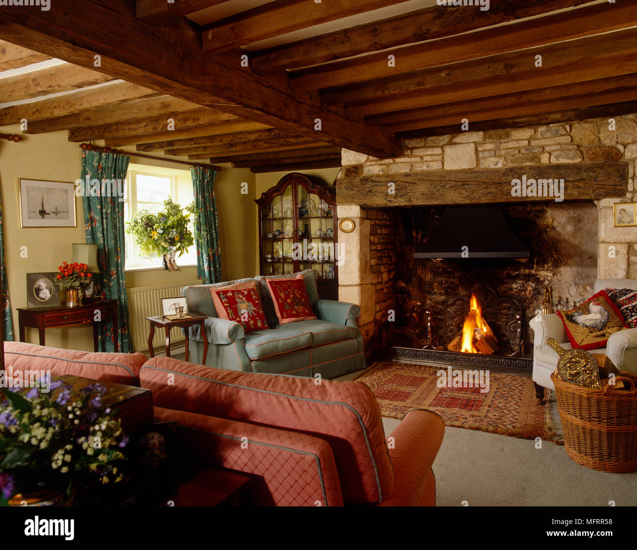 Country Style Sitting Room With Wooden Beamed Ceiling And