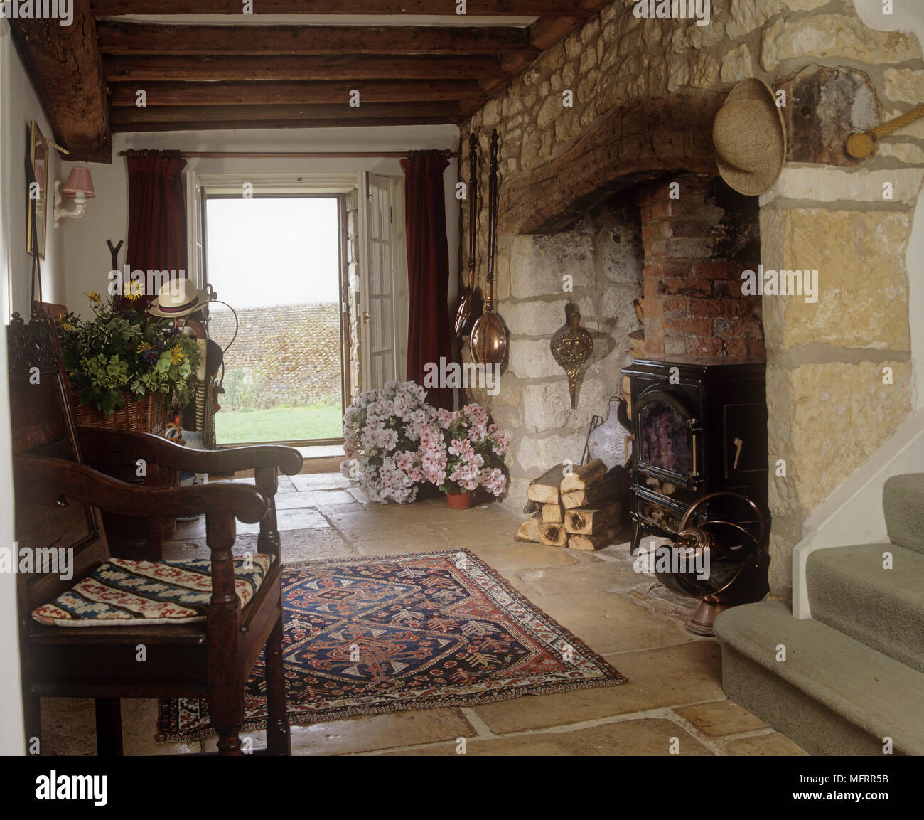 Country Style Hallway With Stone Walls Inglenook Fireplace And