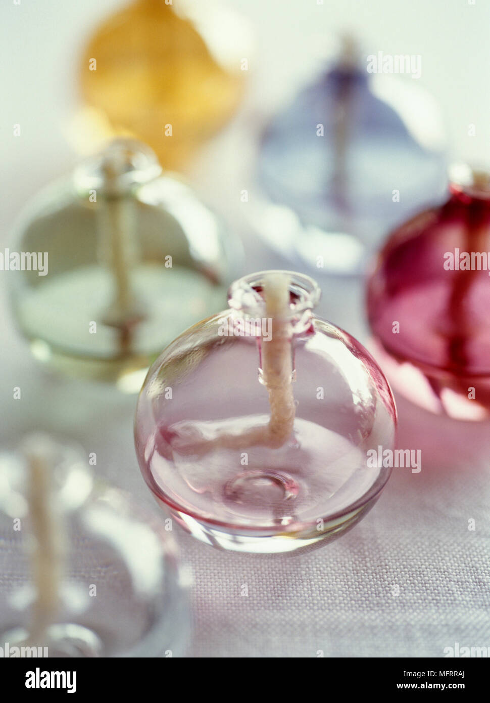 Round glass candle holders on table Stock Photo Alamy