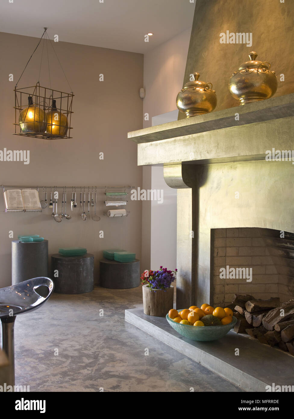 Brass Pots On Mantelpiece Of Contemporary Fireplace Stock Photo