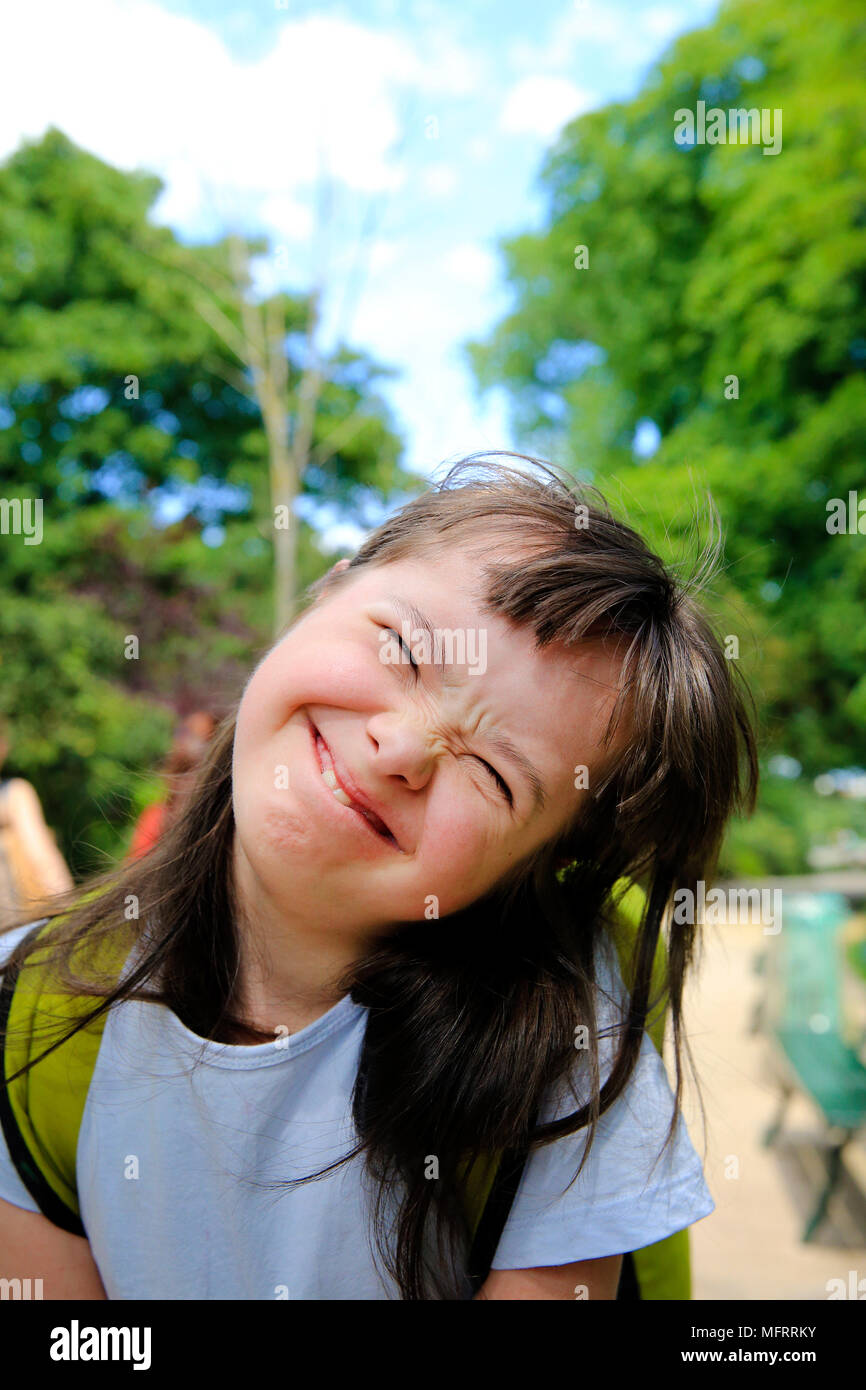 Portrait of little girl smiling in the park Stock Photo - Alamy