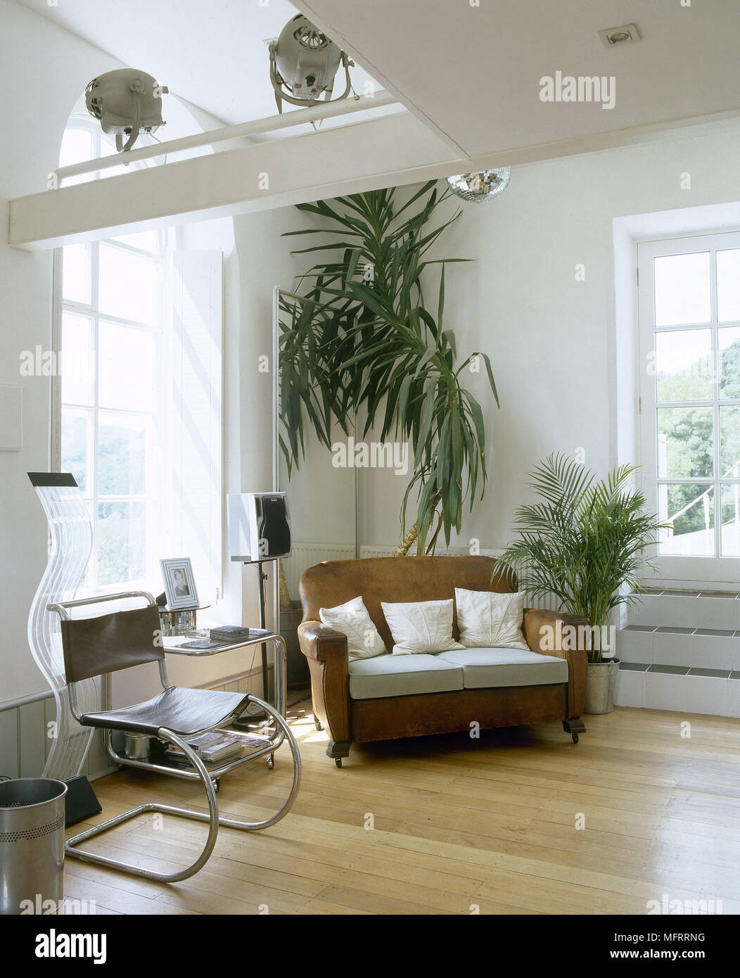 A modern sitting room with retro styling wood floor leather armchair