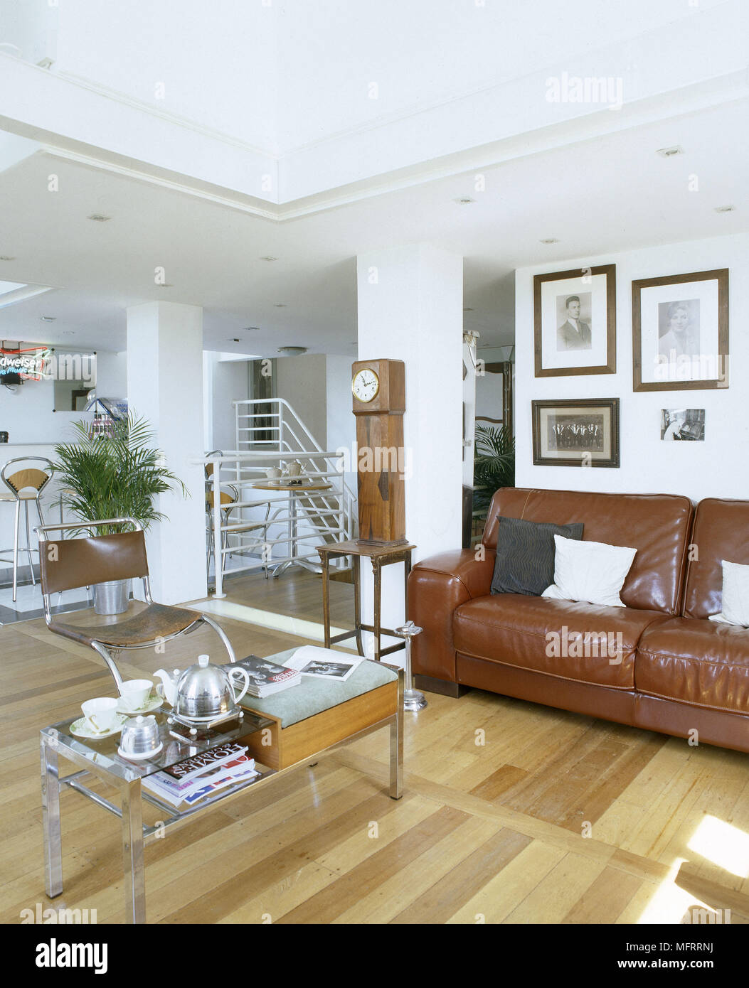 A modern sitting room with retro styling wood floor leather armchair