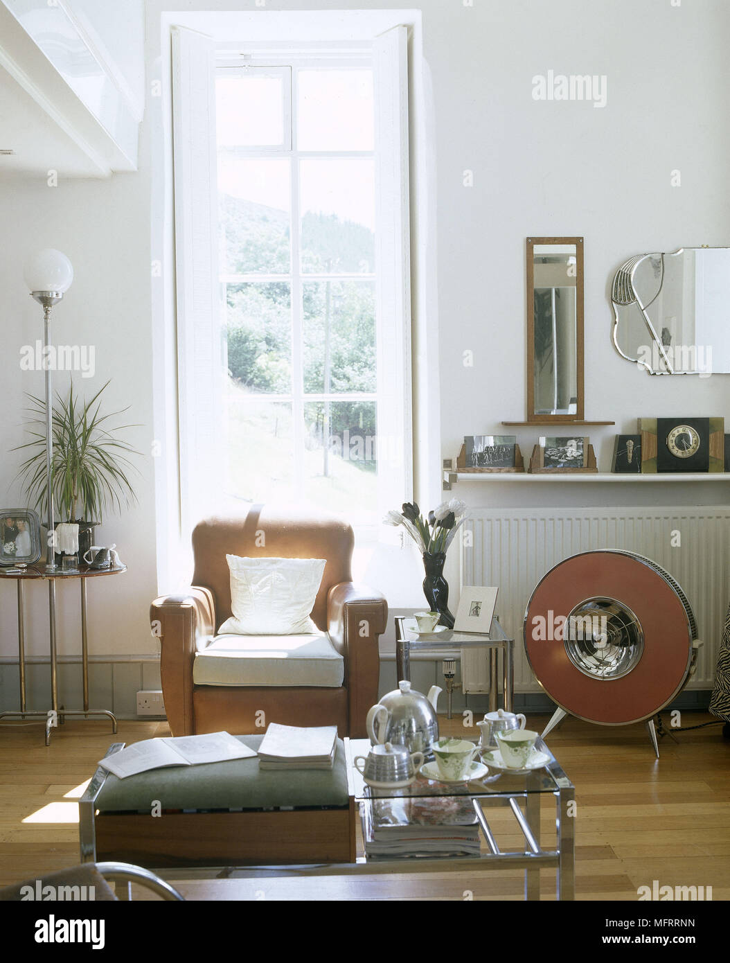 View of A modern sitting room with retro styling wood floor leather armchair ...