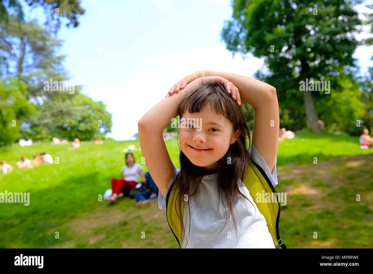 Portrait of little girl smiling in the park Stock Photo - Alamy