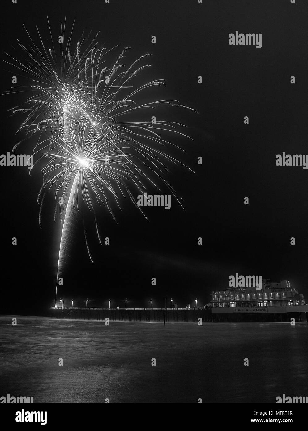 Fireworks being shot from the pier at Daytona Beach in Florida Stock