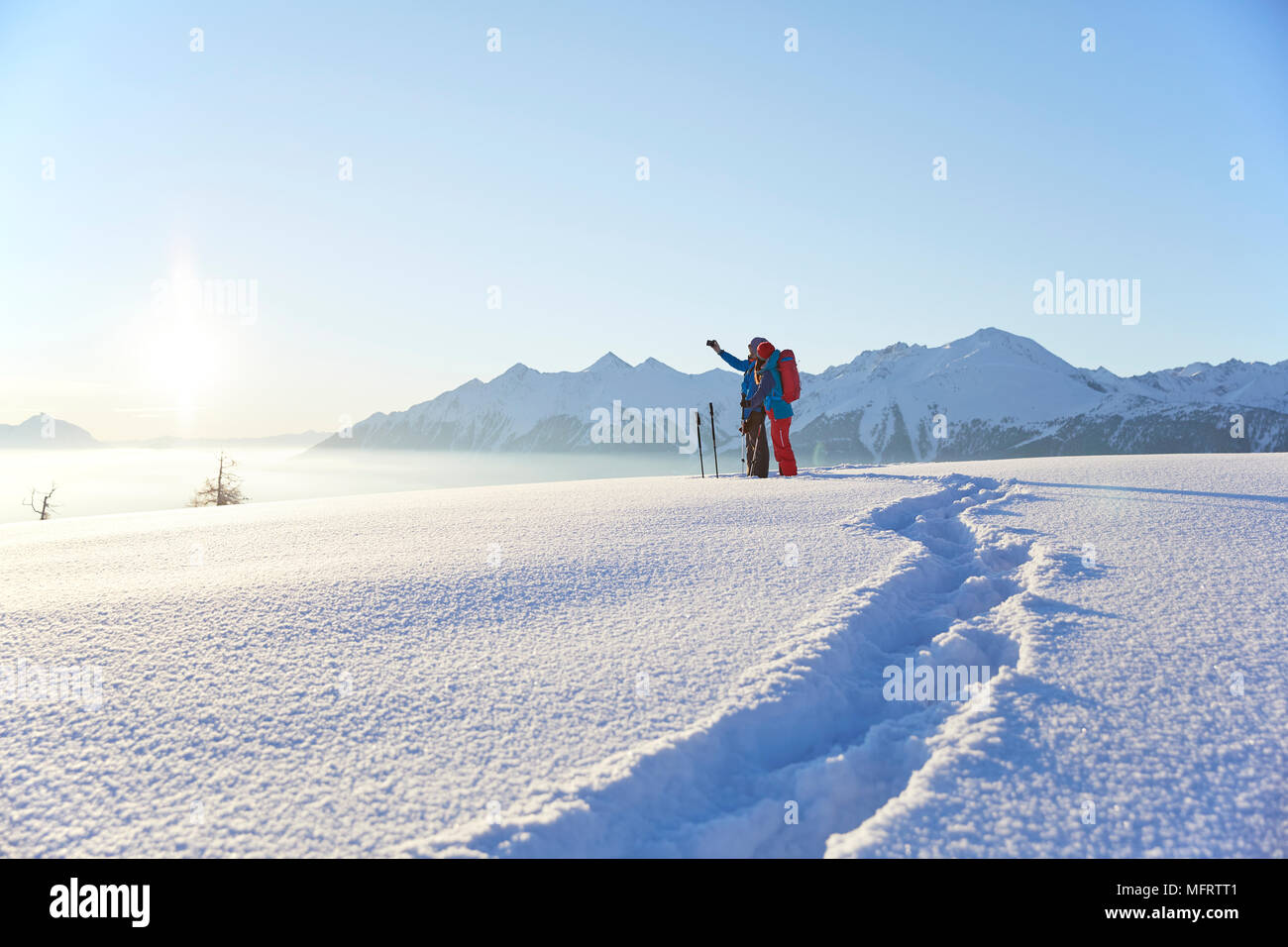 Snowshoeing, hiking in winter landscape, Simmering Alm, Obsteig, Mieming, Tyrol, Austria Stock Photo