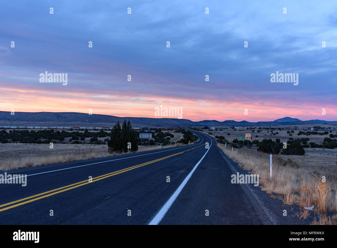 The road leading to Seligman, Arizona at twilight Stock Photo