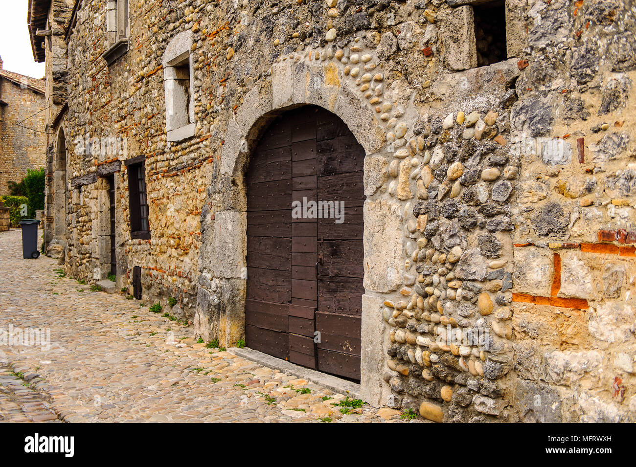Narrow street in Perouges, France, a medieval walled town, a popular ...
