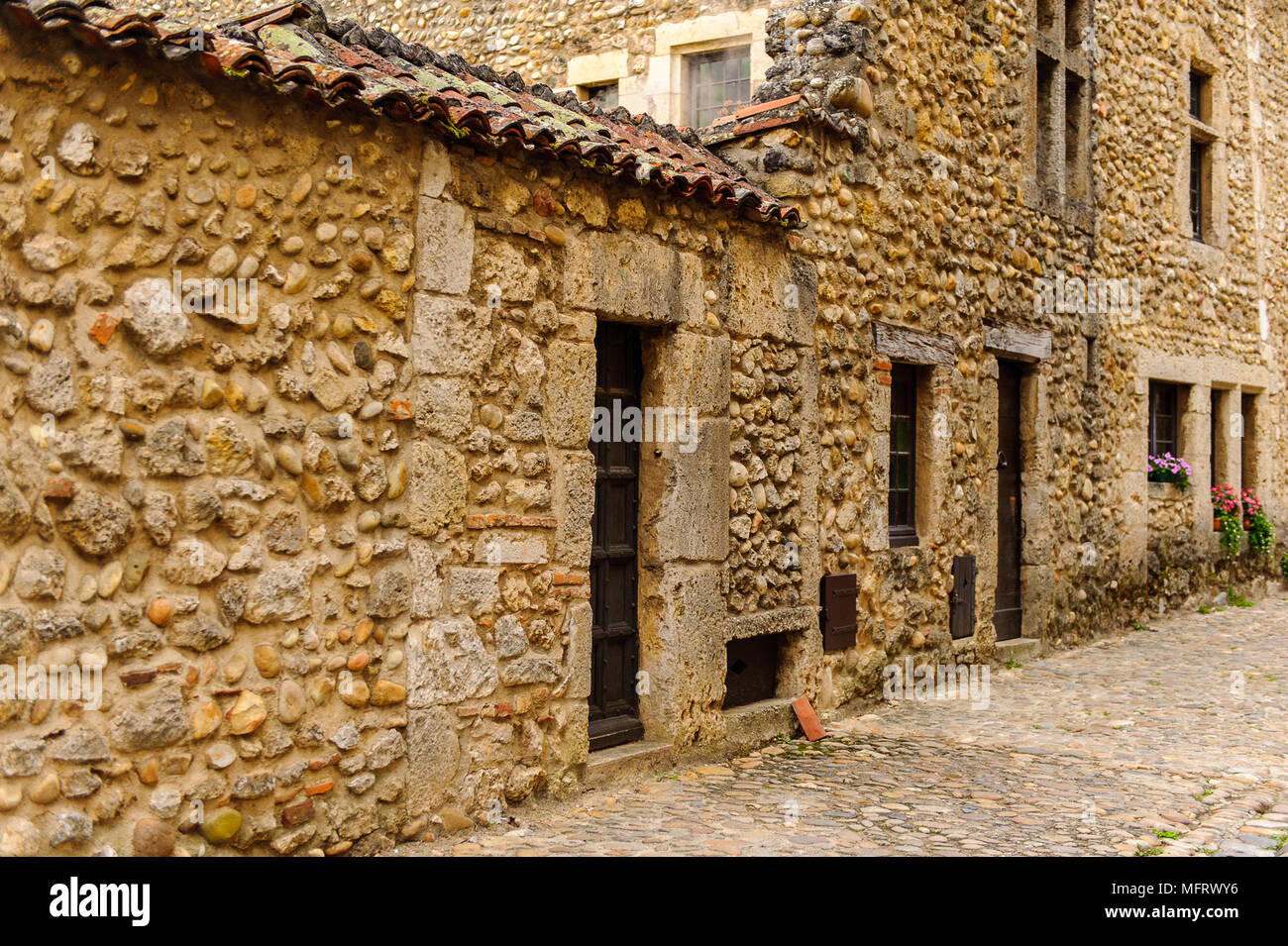 Narrow street in Perouges, France, a medieval walled town, a popular ...