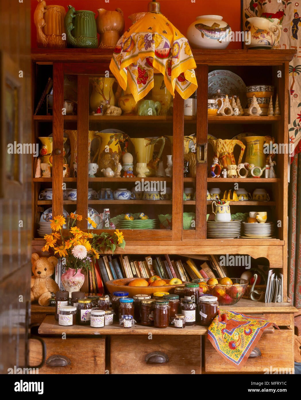 A Detail Of A Country Kitchen Wooden Dresser With Sliding Glass