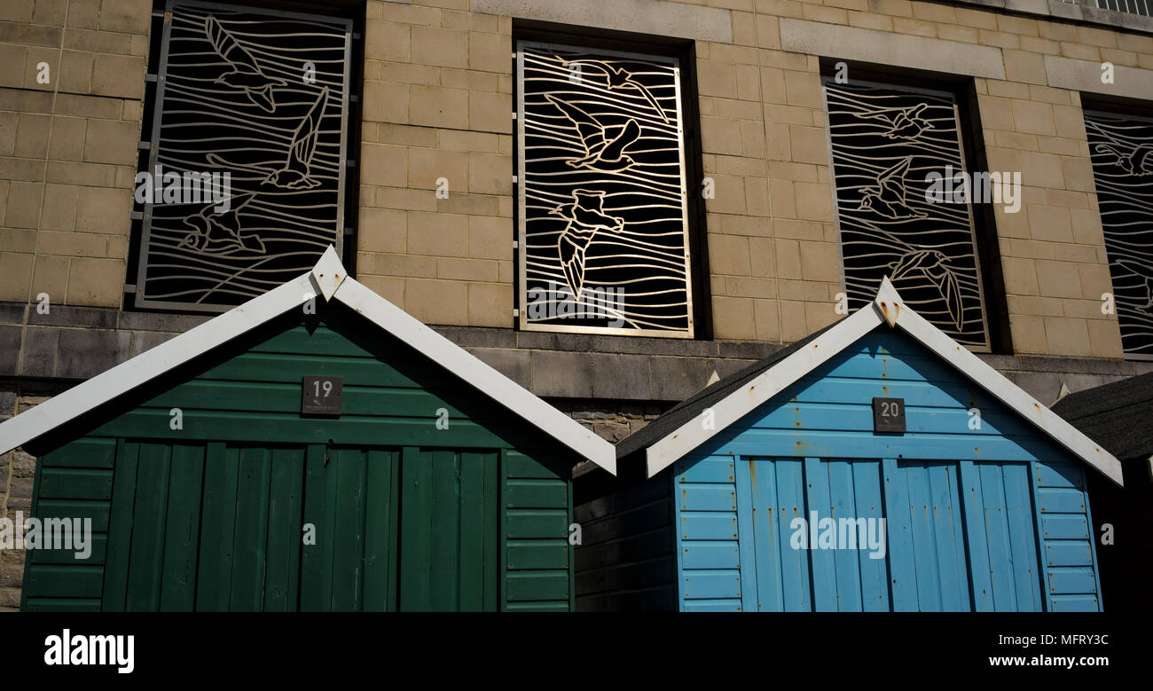 Metal gate sculptures with patterns of seagulls catch the sun on a ...