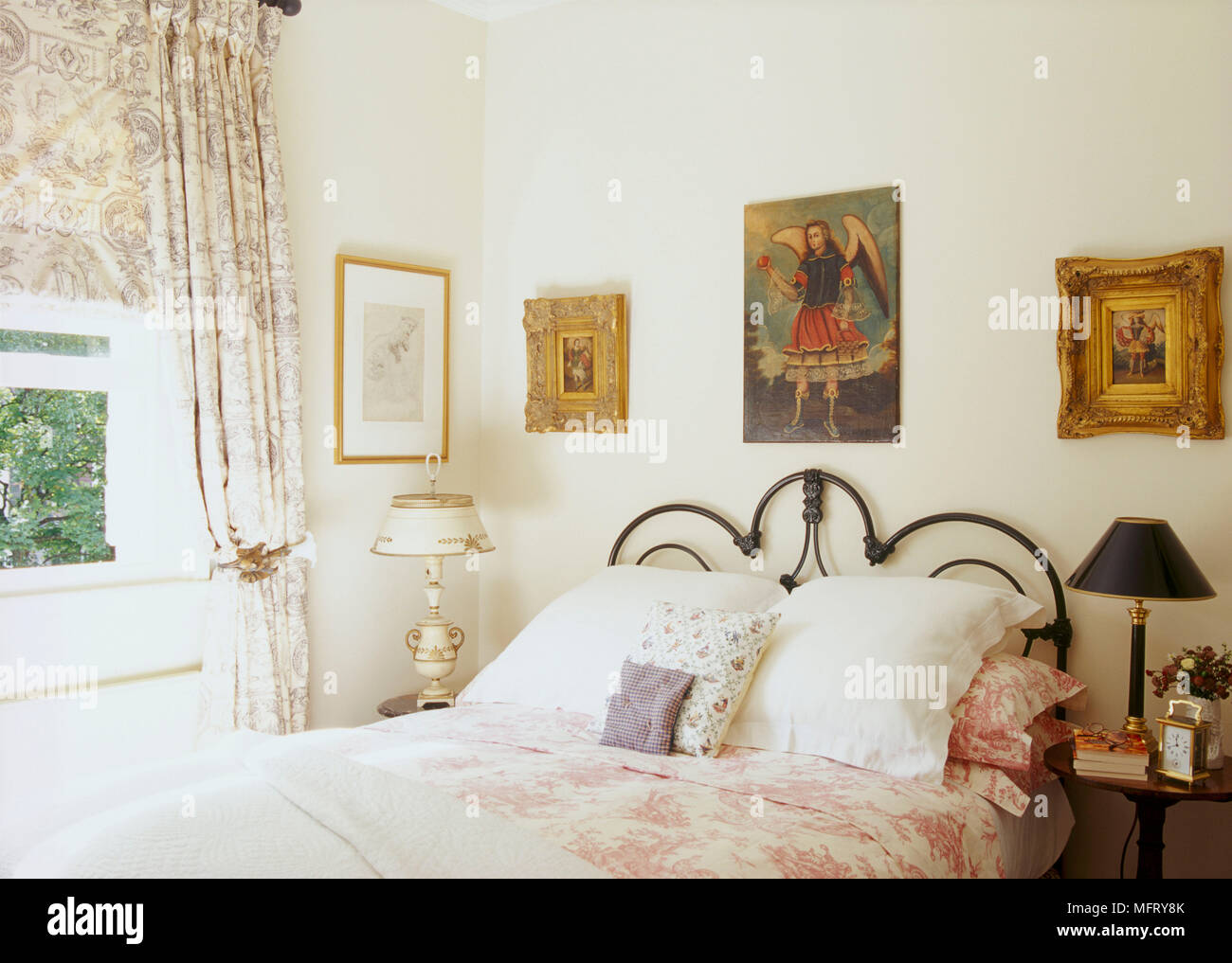 A Detail Of A Traditional Neutral Bedroom With Wrought Iron Double