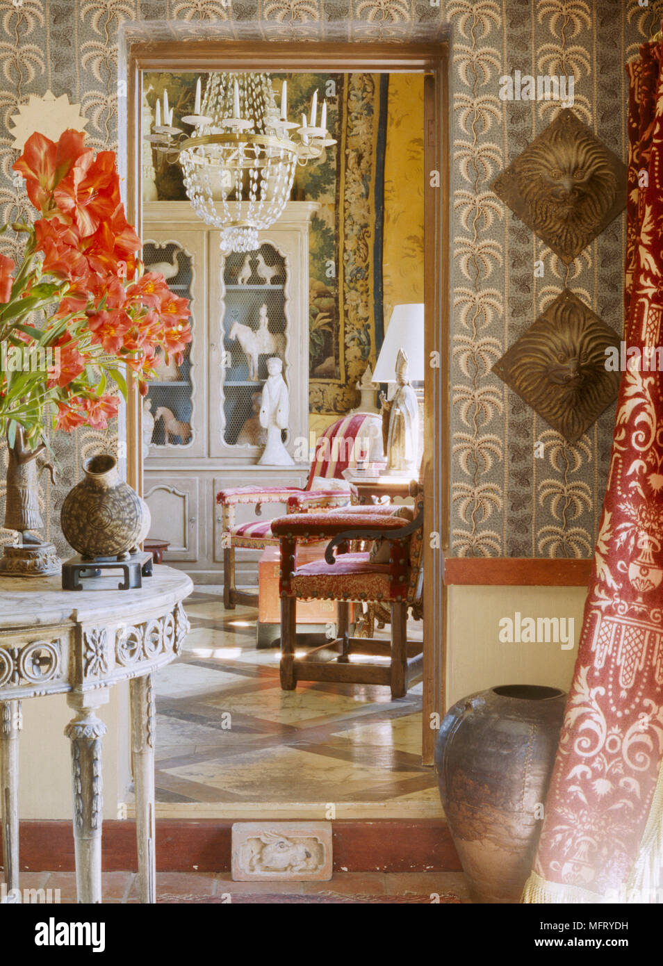 A traditional sitting room decorated in an opulent style with rich ...