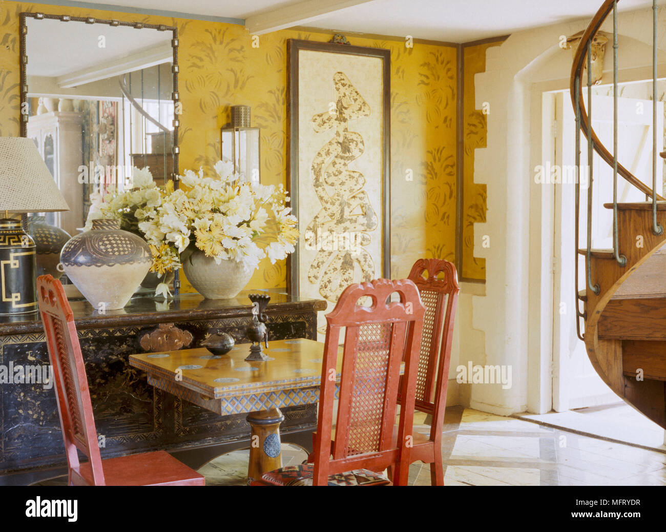 A traditional yellow dining room with pattern wallpaper table painted chairs carved sideboard Stock Photo - Alamy A traditional yellow dining room with pattern wallpaper table painted chairs carved sideboard Stock Photo - Alamy