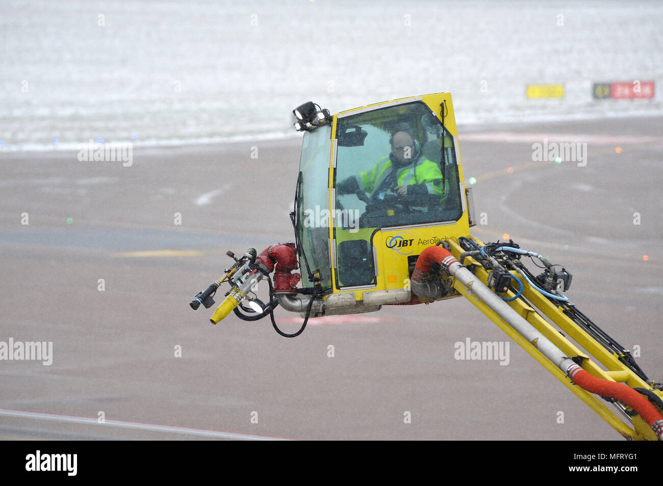 Aircraft Deicing jet wash machine with operator at Luton Airport
