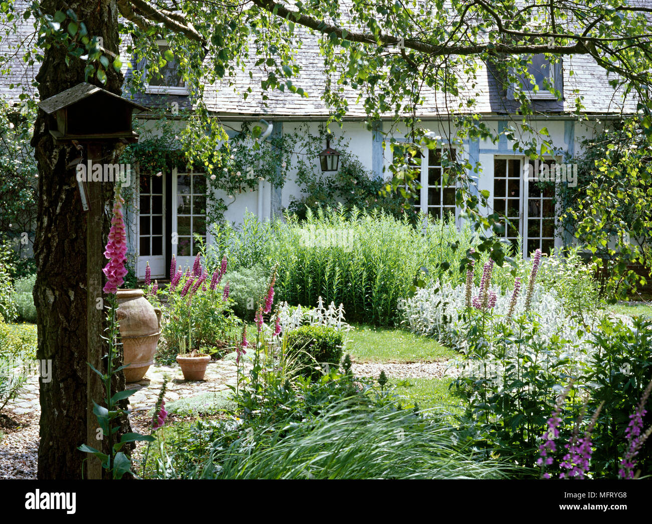 Country garden designed by Sylvie Anibel  Exteriors cottages houses farmhouses france gardens Stock Photo