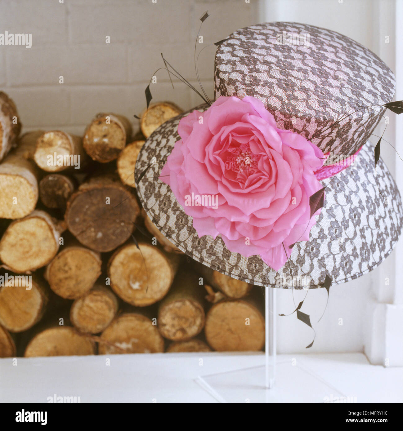 Detail Of A Fireplace Hearth Piled With Logs A Black And White Hat