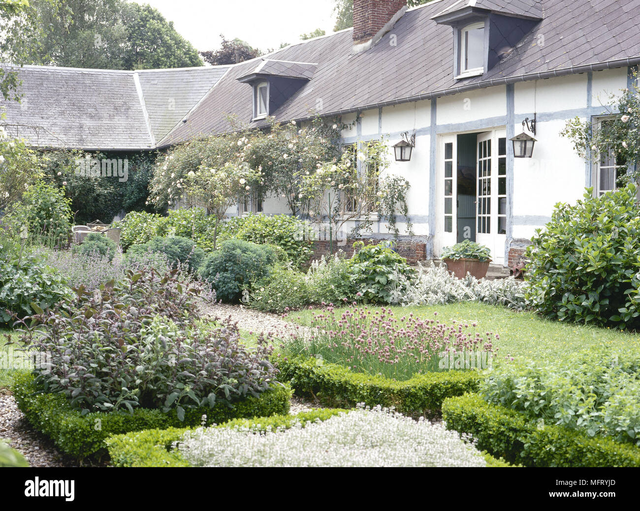 Exterior country house garden designed by Sylvie Anibel  Exteriors cottages houses farmhouses france gardens Stock Photo