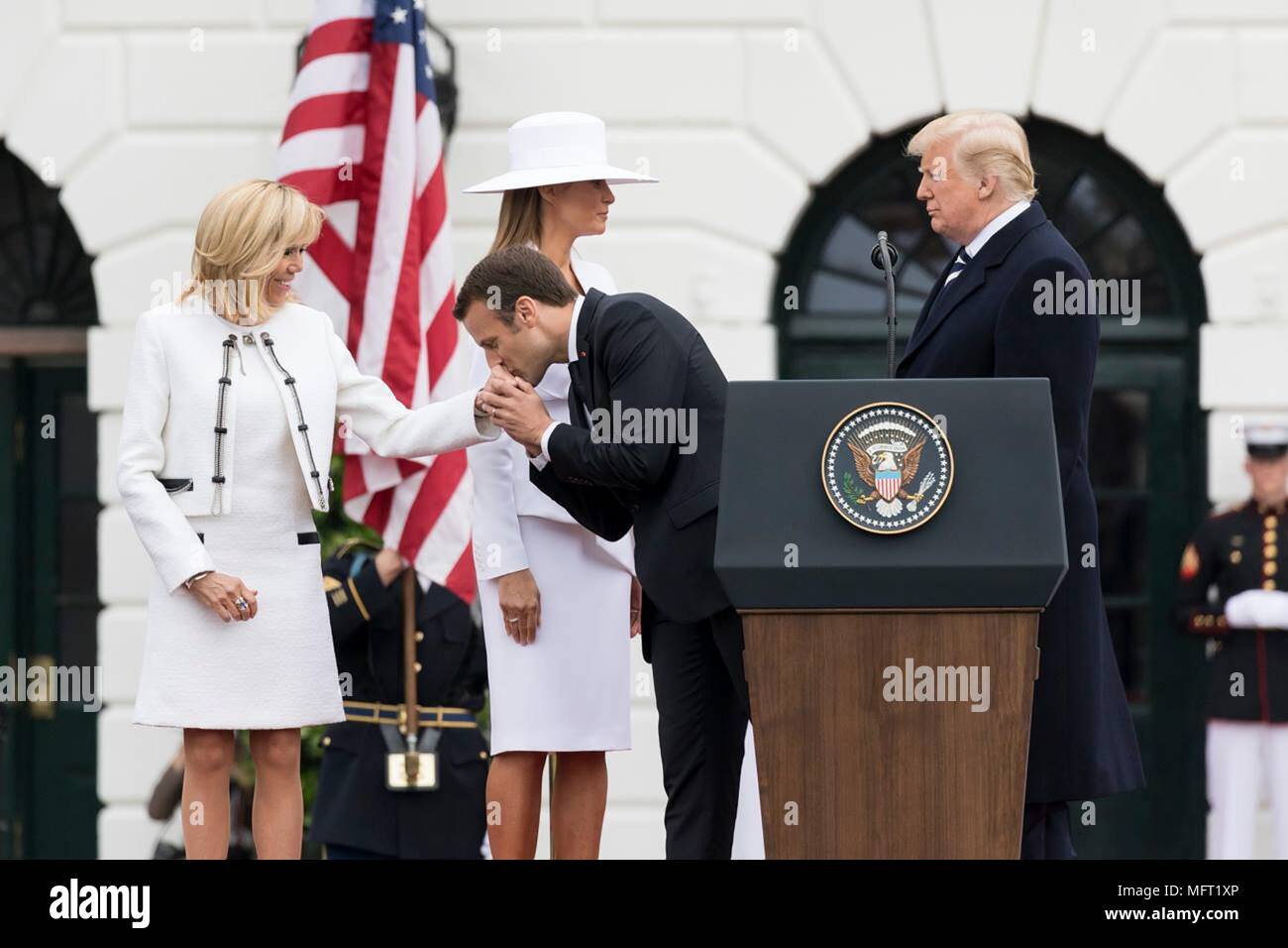 French President Emmanuel Macron Kisses The Hand Of His Wife Brigitte Macron Left As U S President