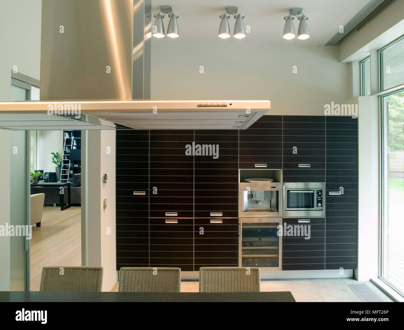 Extractor fan over worktop in kitchen with fitted units Stock Photo Alamy