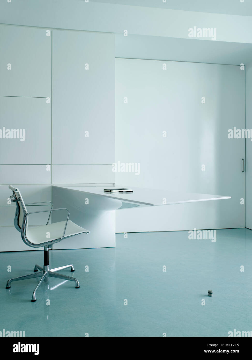 A Detail Of A Modern Minimalist White Study Room A Moulded Desk