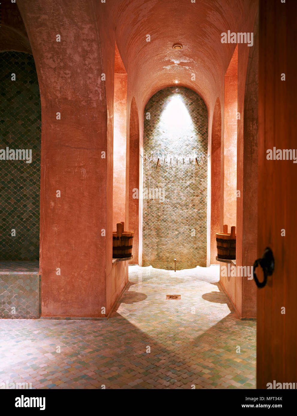 Moroccan terrracotta shower room vaulted ceiling mosaic tiling