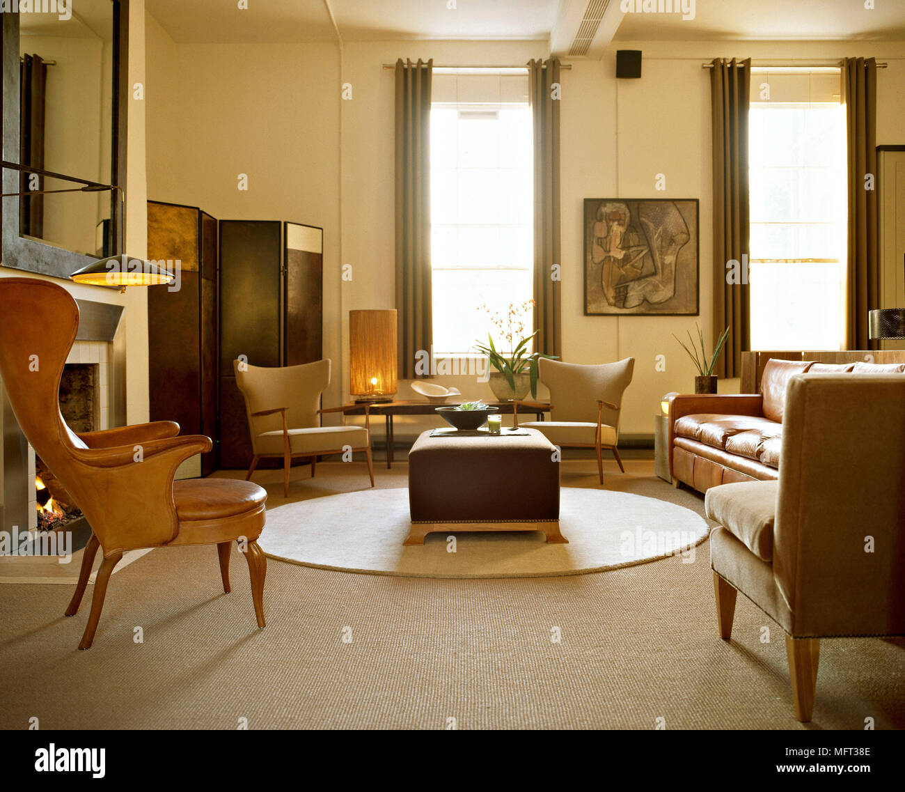 Modern Sitting Room Brown Leather Armchairs And Sofa