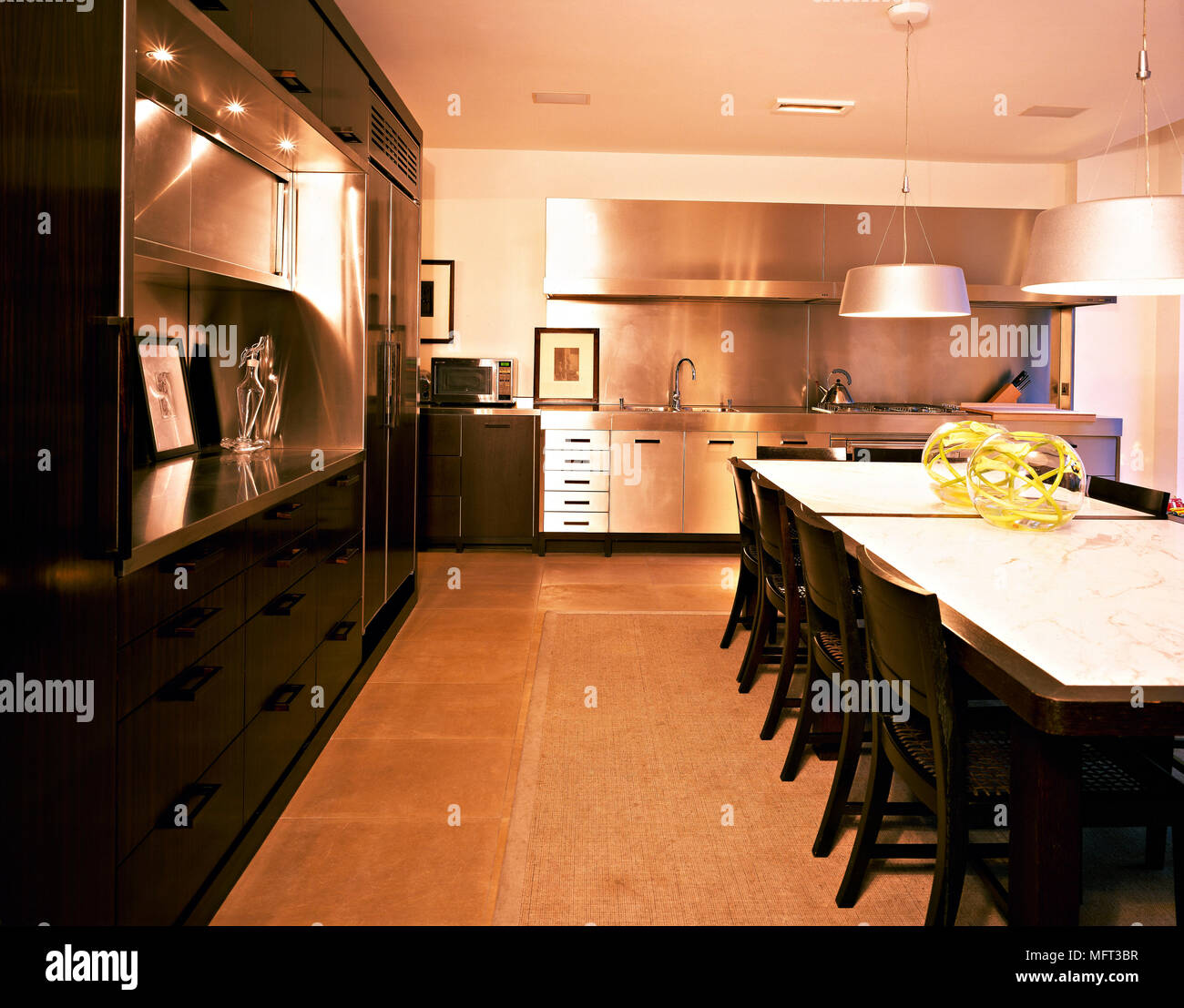 Modern kitchen dining area wood stainless steel units table chairs ...