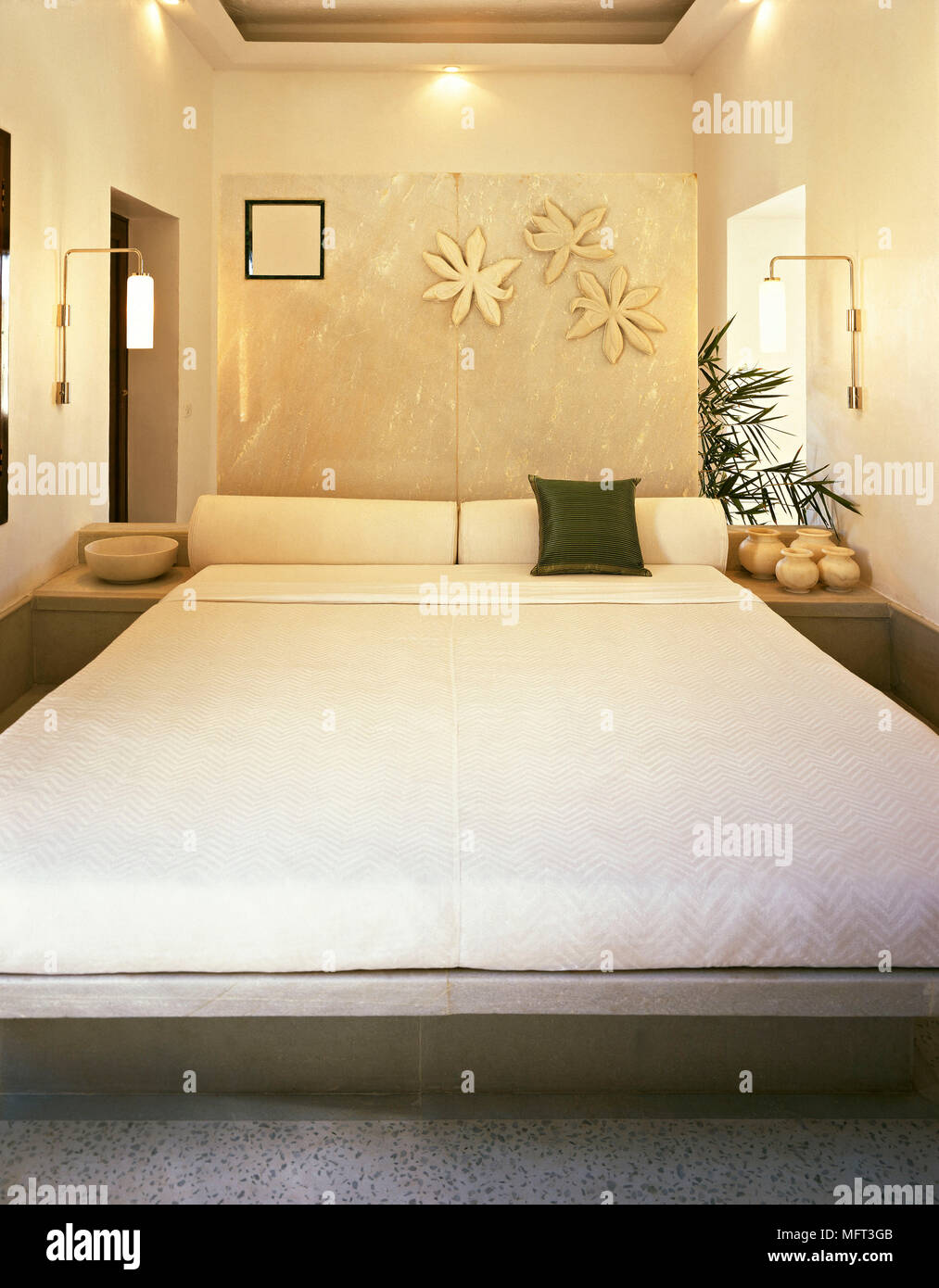 Hotel bedroom suite marble headboard bed Interiors hotels bedrooms beds  Stock Photo - Alamy