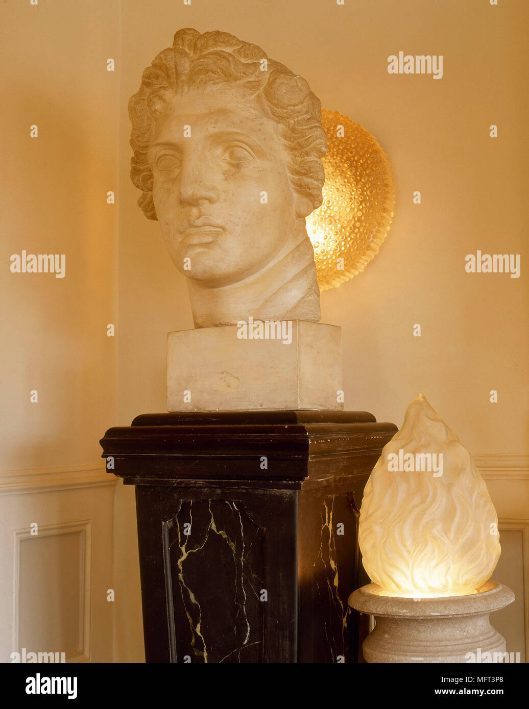 Bust statue on plinth  interiors detail lighting Stock Photo