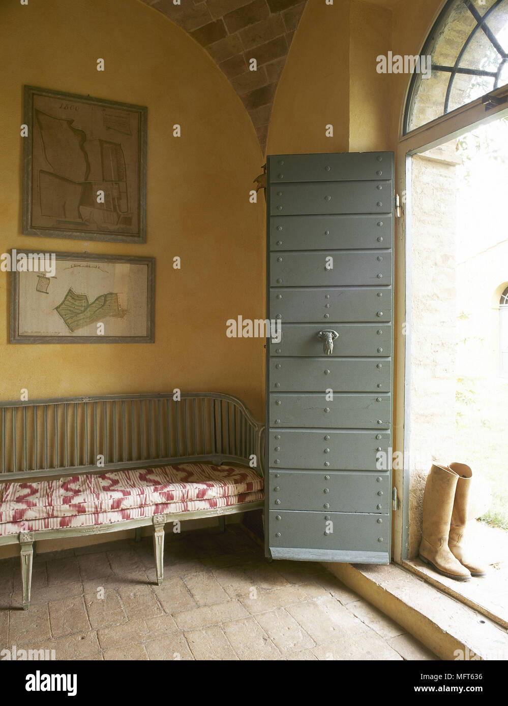 Country Style Yellow Hallway With Open Painted Door And Bench Seat