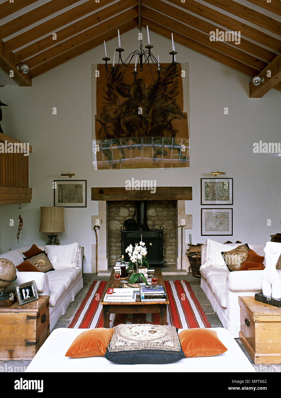 Facing Pair Of Sofas Either Side Of Fireplace In Country Style