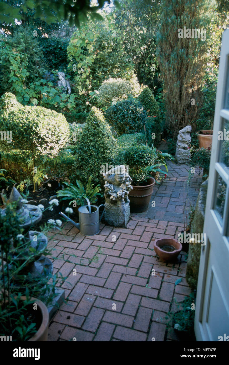 A Detail Of A Country Garden With A Paved Patio Area Clipped