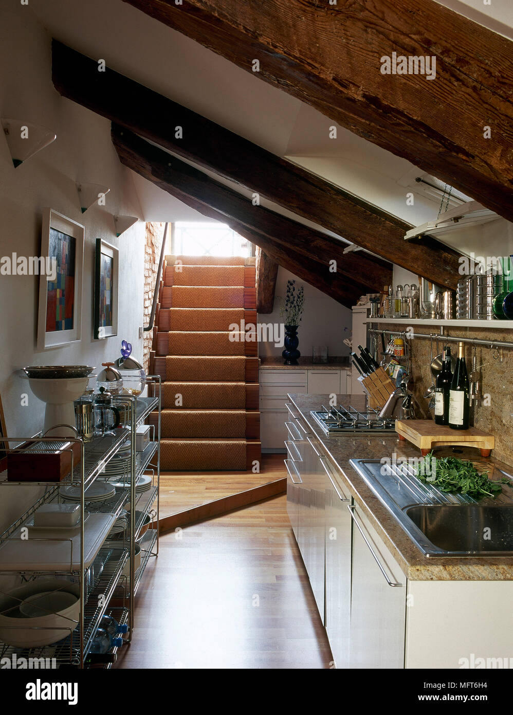 Country Kitchen With A Beamed Sloping Ceiling White