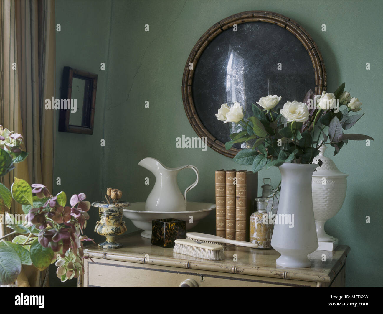 A Detail Of A Traditional Green Bedroom A Bamboo Cane Chest Of
