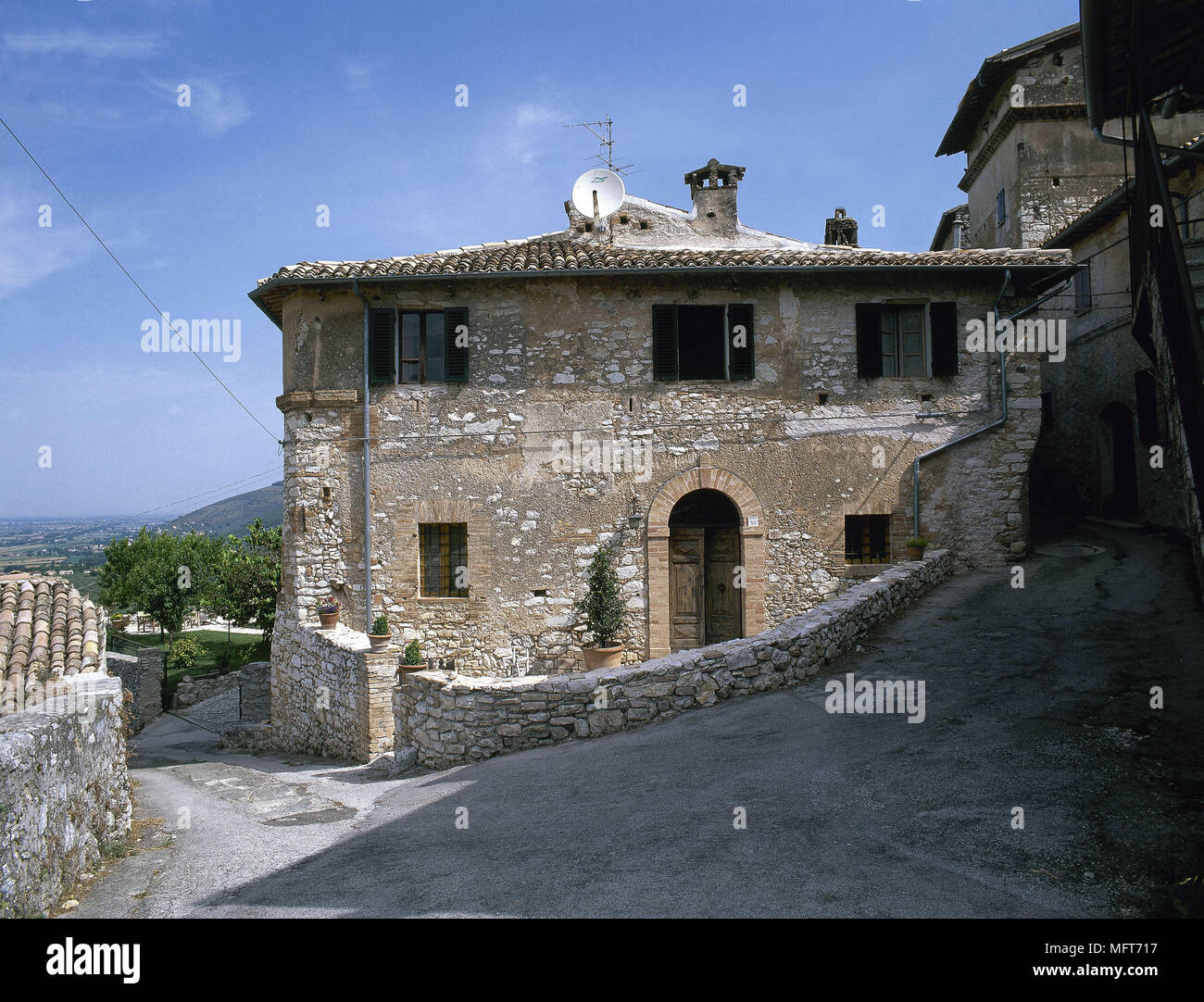 Exterior rustic stone villa ached doorway window shutters  Exteriors houses villas country Stock Photo