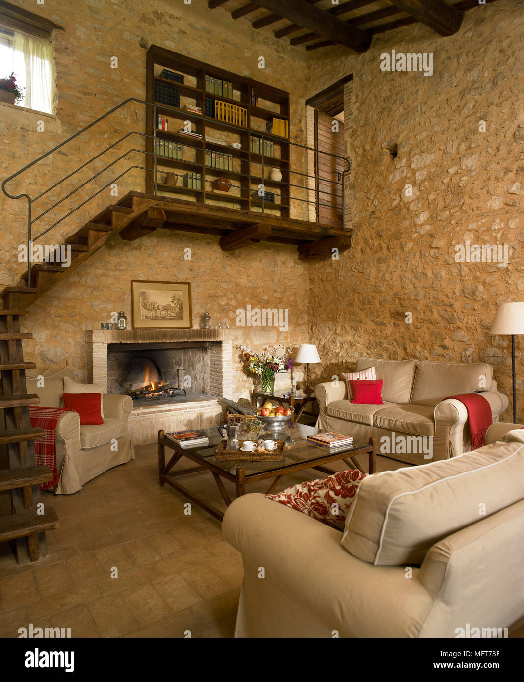 A Country Sitting Room With Rustic Stone Fireplace And