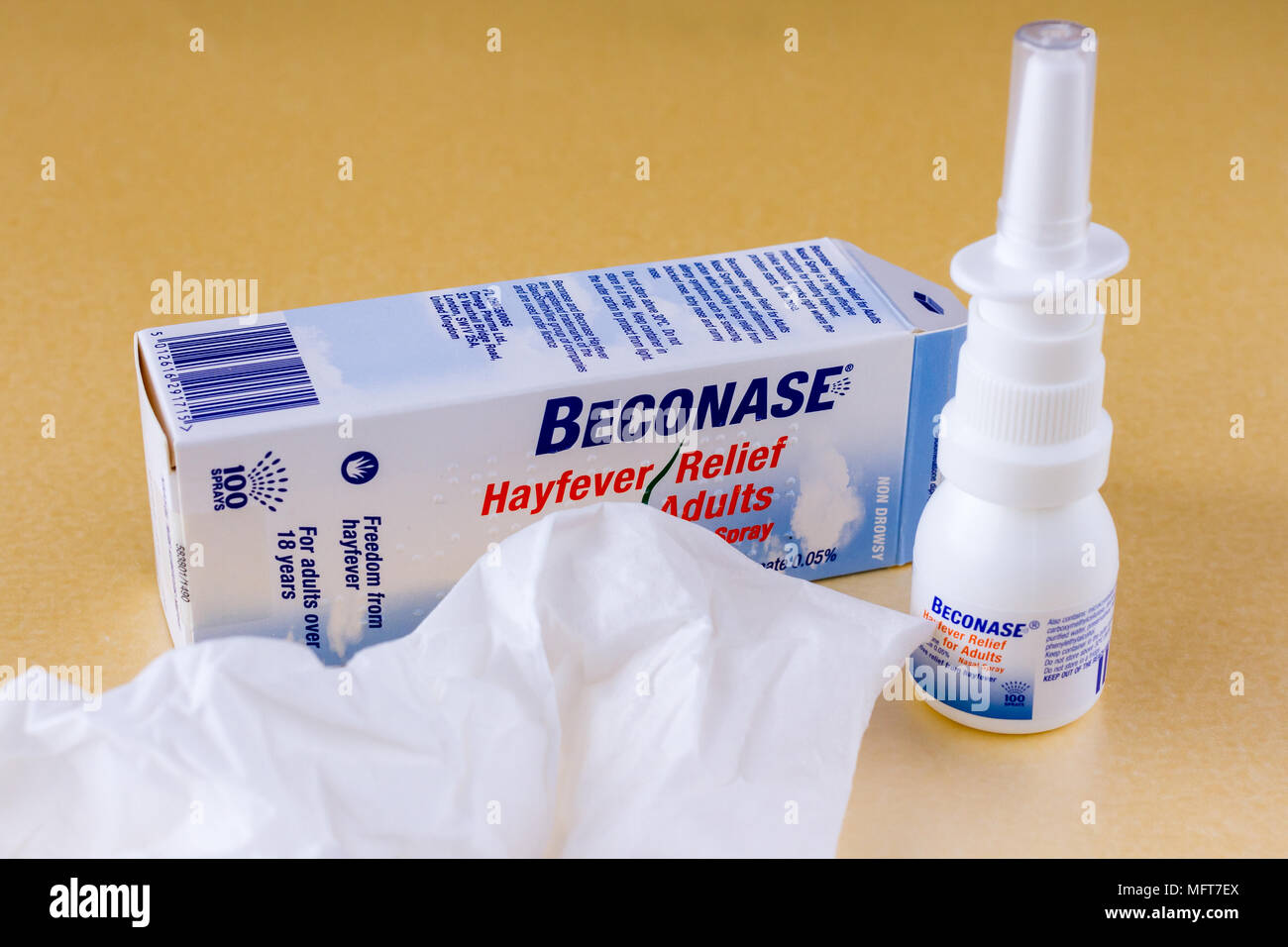 Beconase hayfever allergy nasal spray and a used tissue, England, United Kingdom Stock Photo