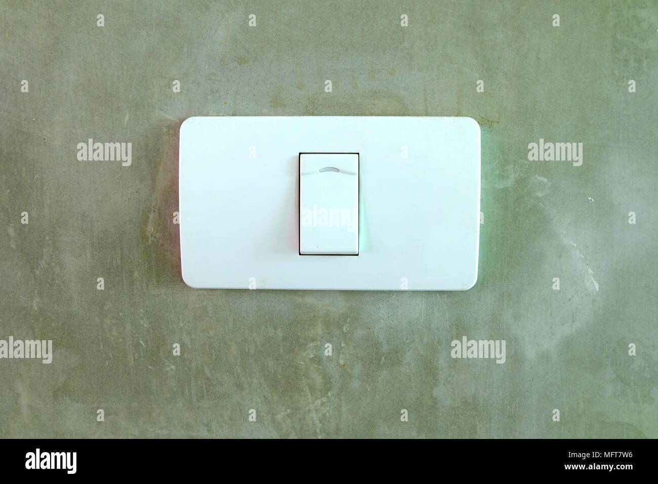 Electric Switch on Concrete Wall. Stock Photo