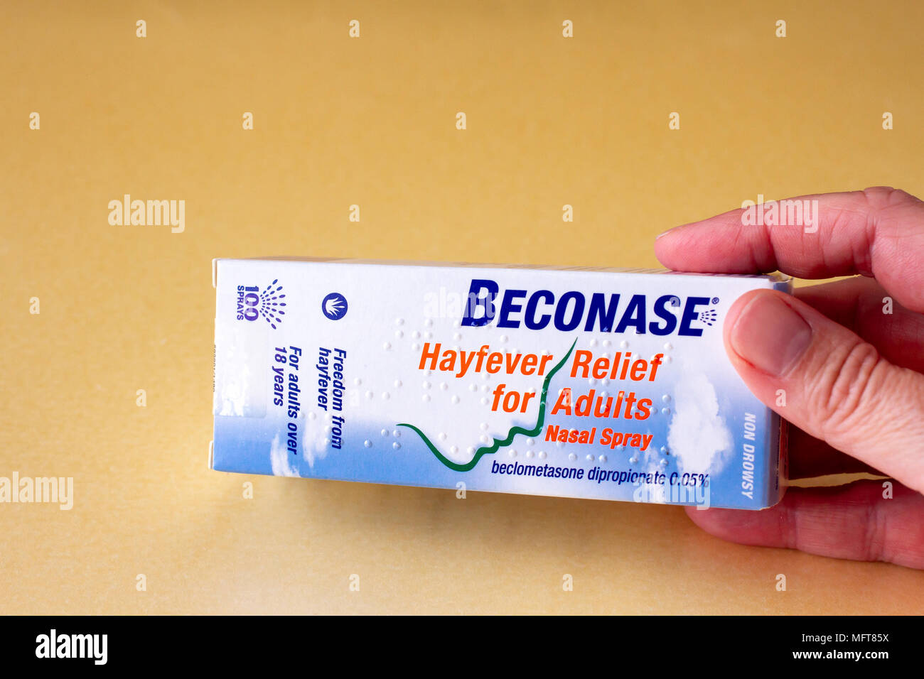 Female hand holding a box containing a Beconase nasal spray, hayfever allergy relief, United Kingdom Stock Photo