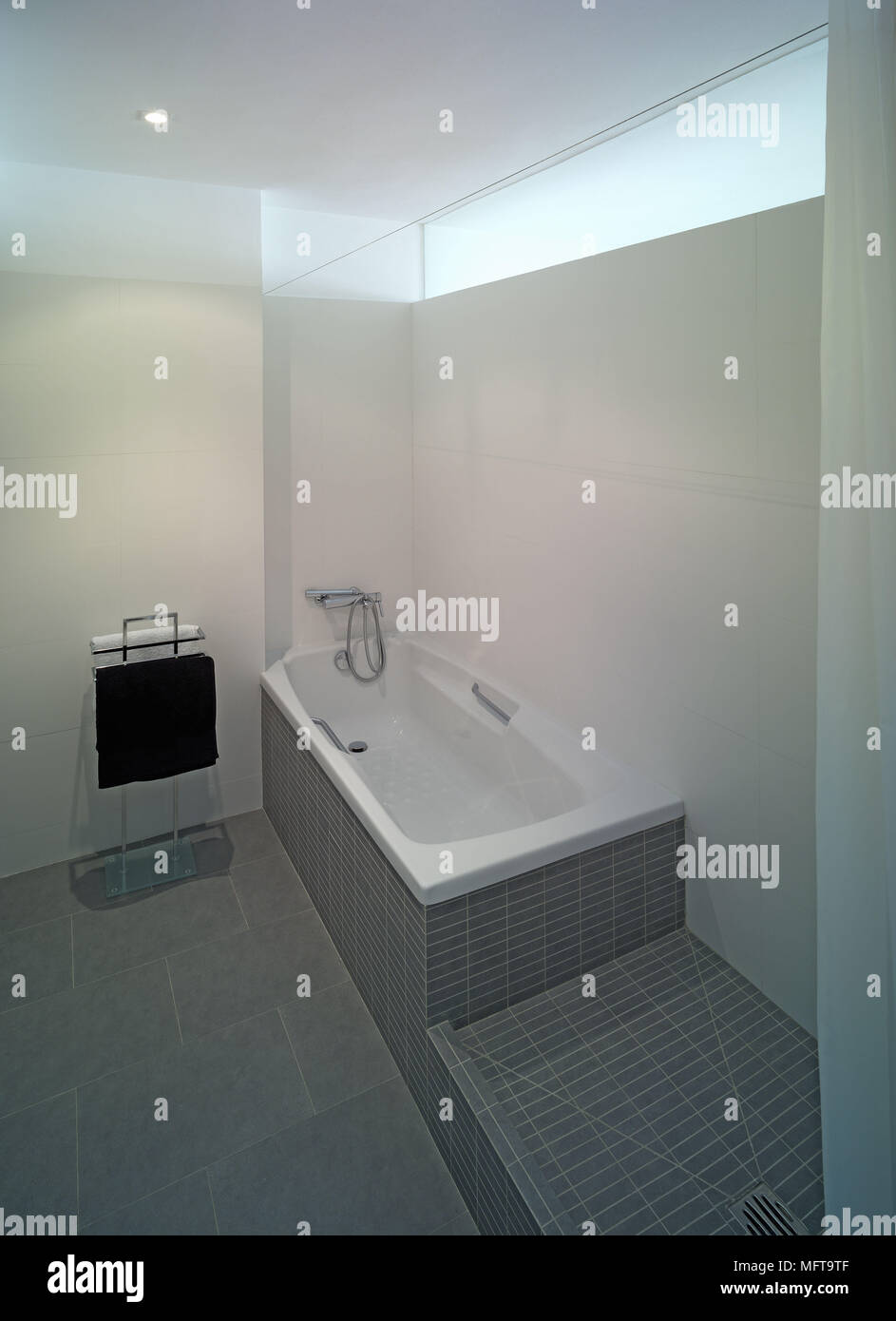 Bathtub in minimalist bathroom Stock Photo Alamy
