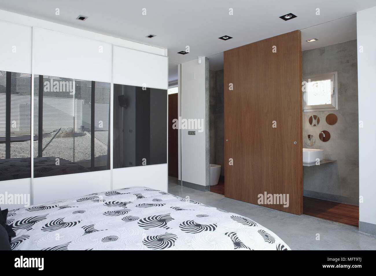 Bedroom With View Through Window With Venetian Blinds To