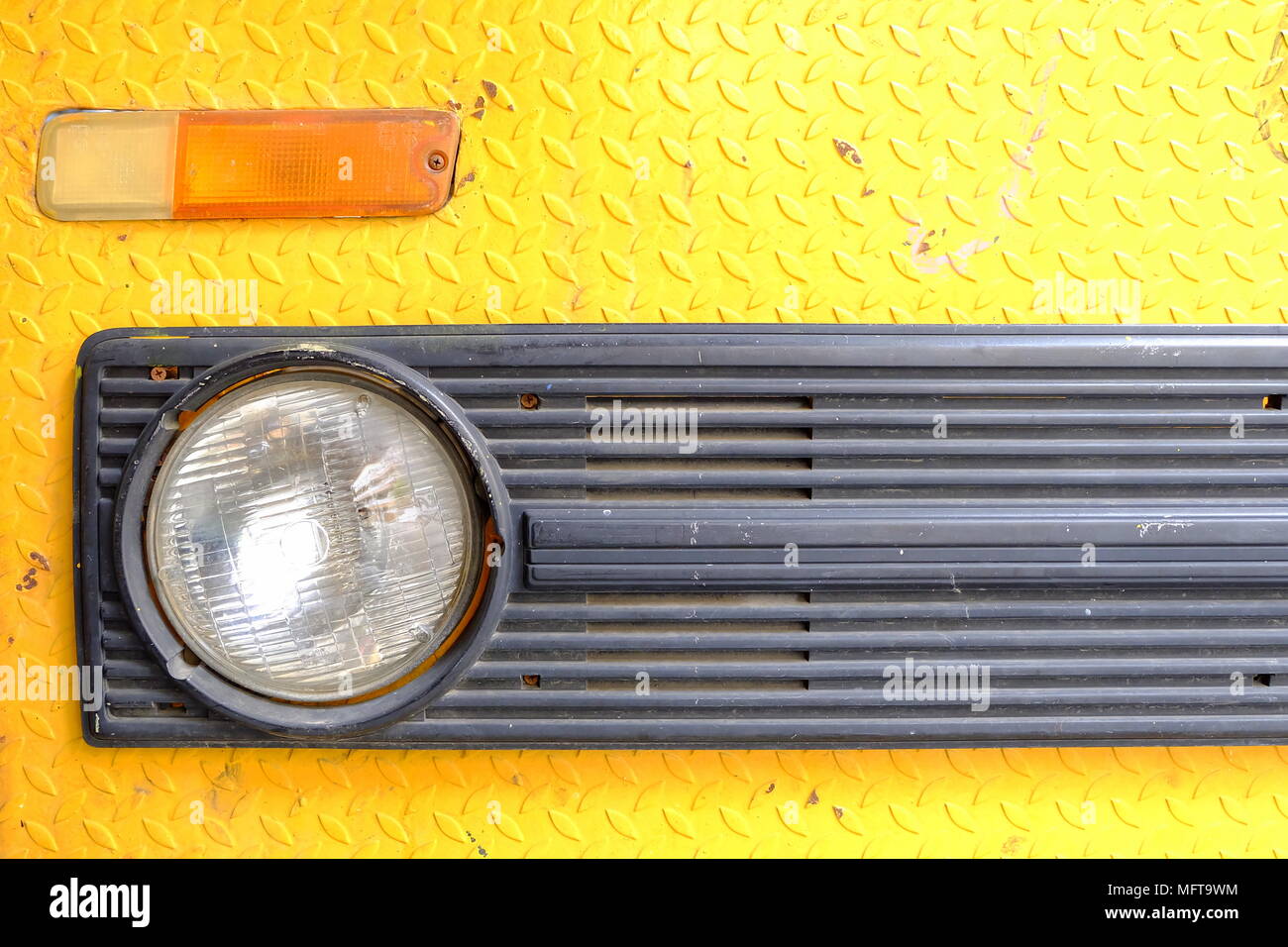 Close up Headlight of Old Yellow Truck Car. Stock Photo