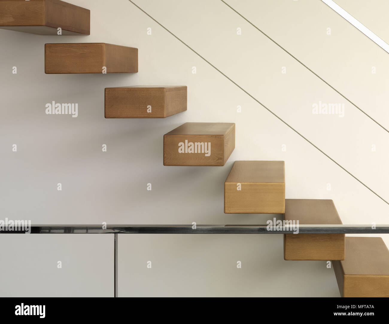 Modern staircase with wall mounted suspended treads Stock Photo Alamy