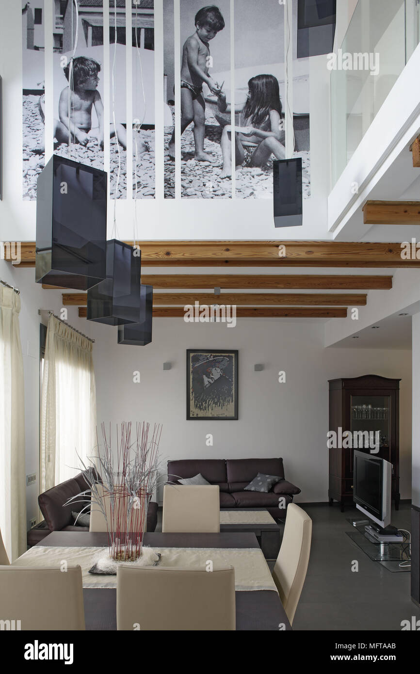 Suspended Ceiling Lights Above Dining Table And Chairs And Seating