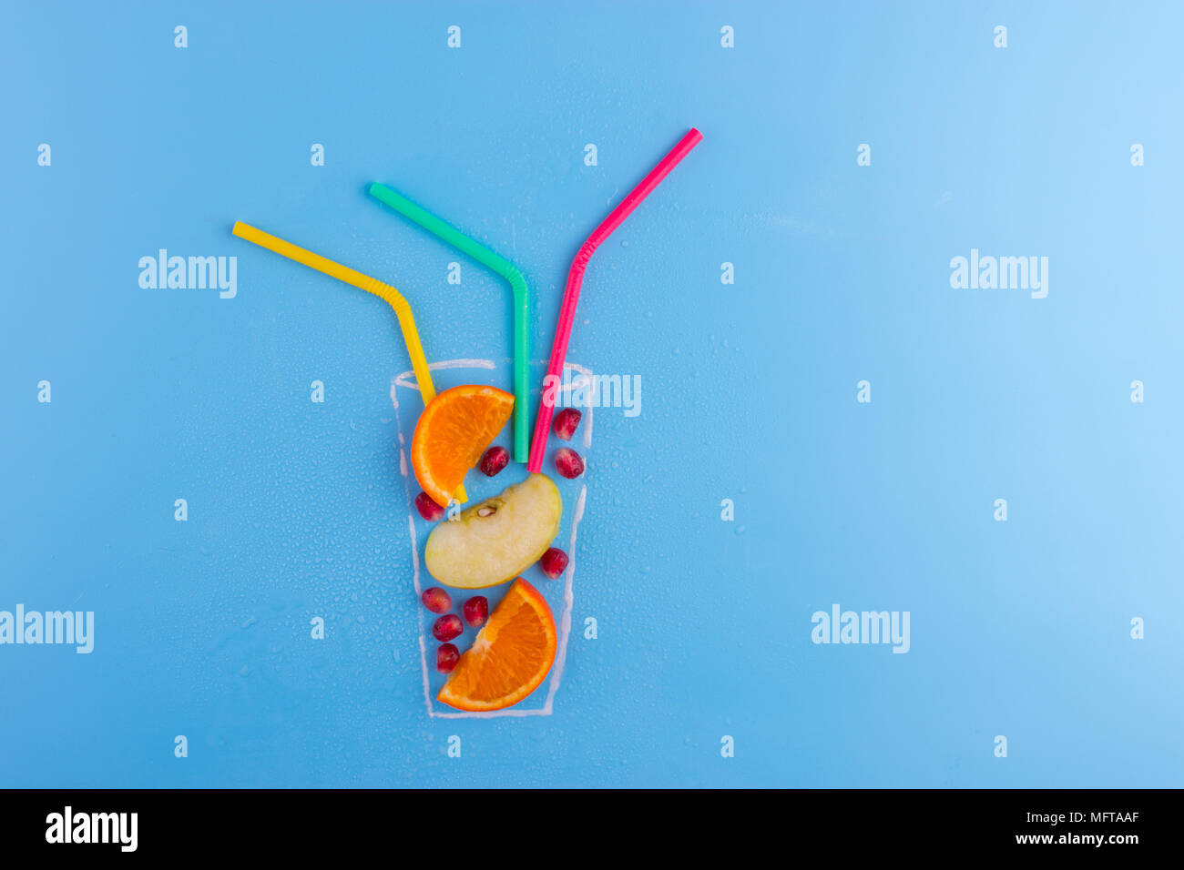fruit cocktail on blue background. drawning of glass Stock Photo - Alamy